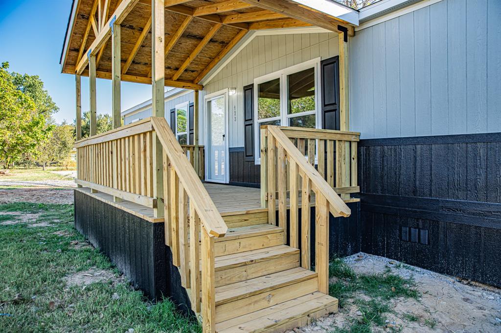 123 Kelly Azle, TX 76020 - Photo 14 of 28 a view of balcony with wooden floor and stairs