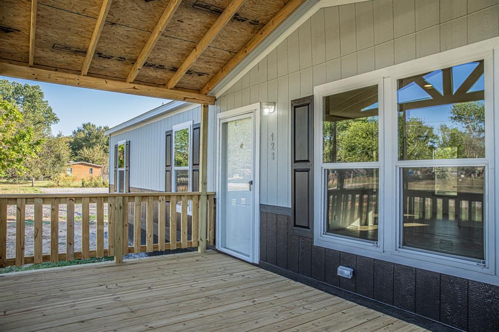 123 Kelly Azle, TX 76020 - Photo 15 of 28 a view of a balcony with wooden floor