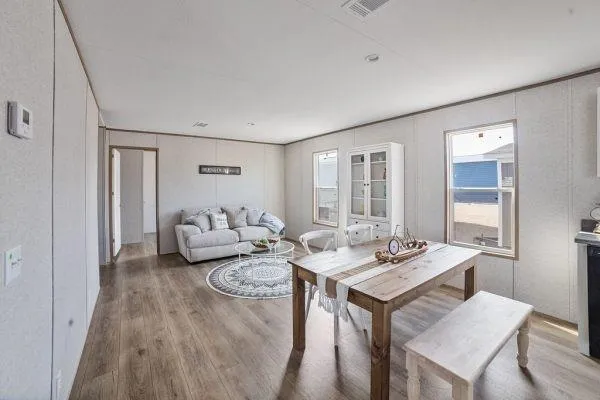 a view of a livingroom with furniture and window