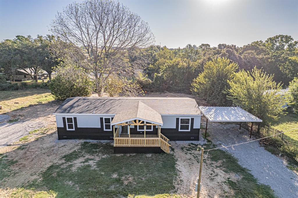 123 Kelly Azle, TX 76020 - Photo 4 of 28 front view of a house with a yard