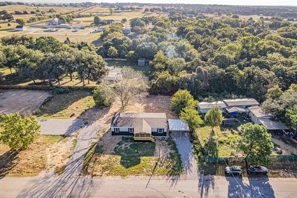 123 Kelly Azle, TX 76020 - Photo 5 of 28 an aerial view of multiple houses with yard