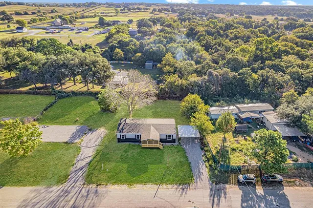 an aerial view of a house with a garden