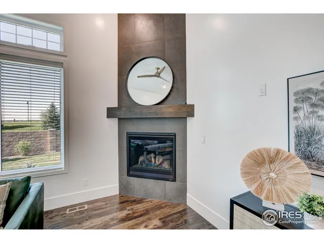 a view of a livingroom with furniture and a fireplace