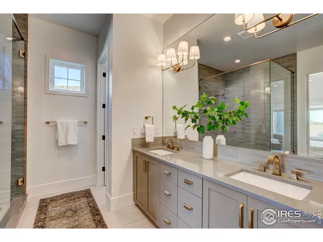 a bathroom with a sink a vanity and a mirror
