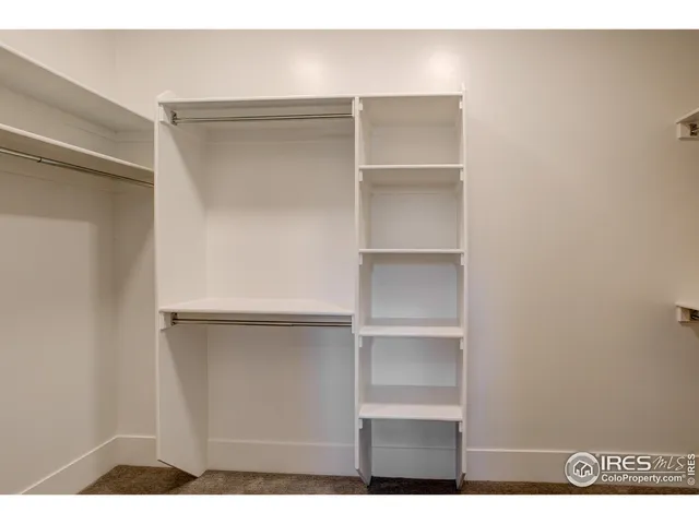 a view of an empty walk in closet