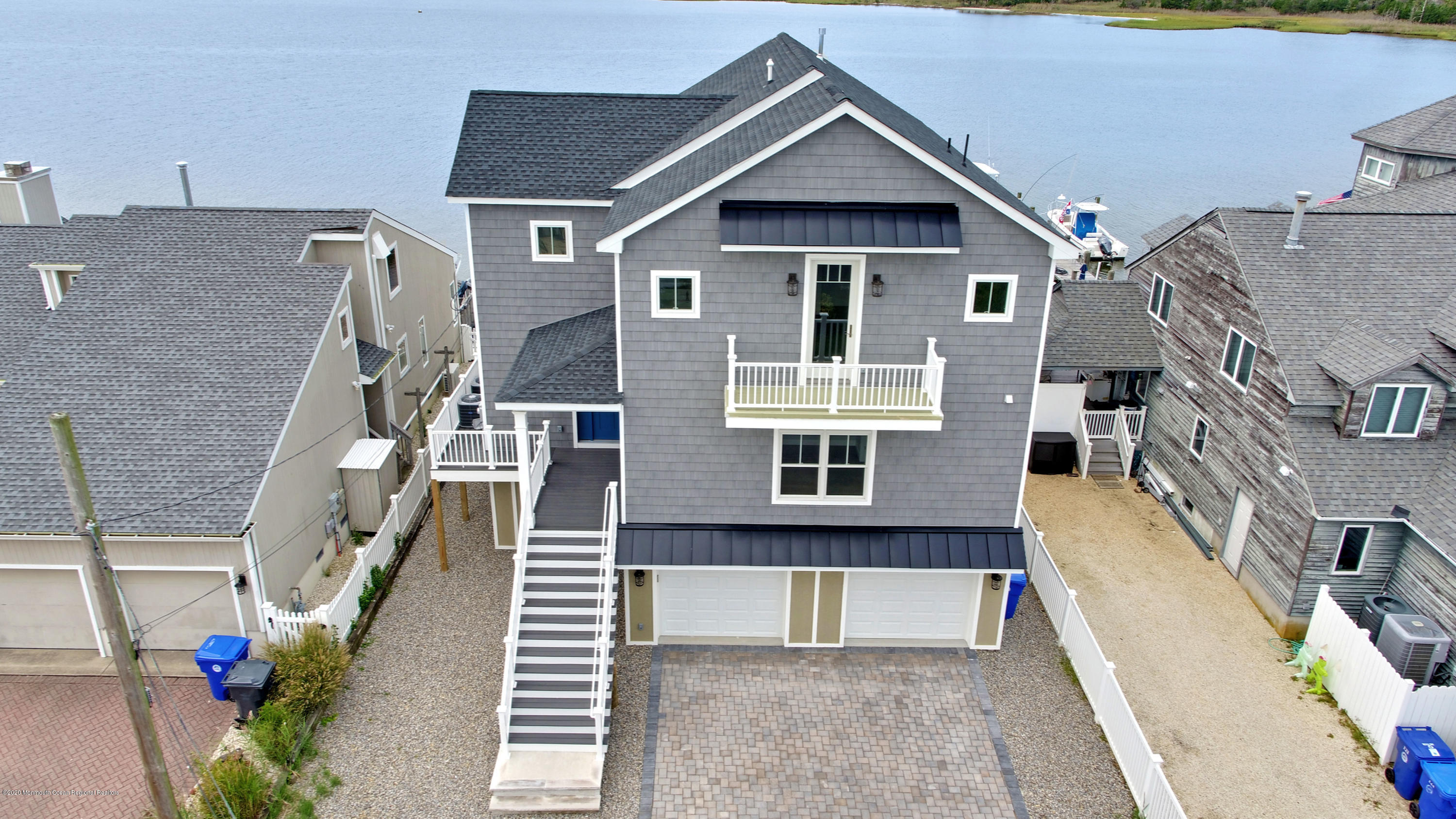 125 Shore Drive Brick, NJ 08723 - Photo 14 of 83 a front view of a house with a yard
