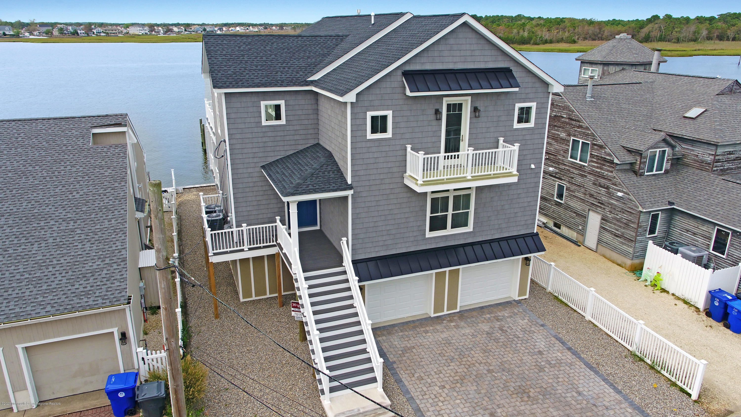 125 Shore Drive Brick, NJ 08723 - Photo 15 of 83 a front view of a house with a yard