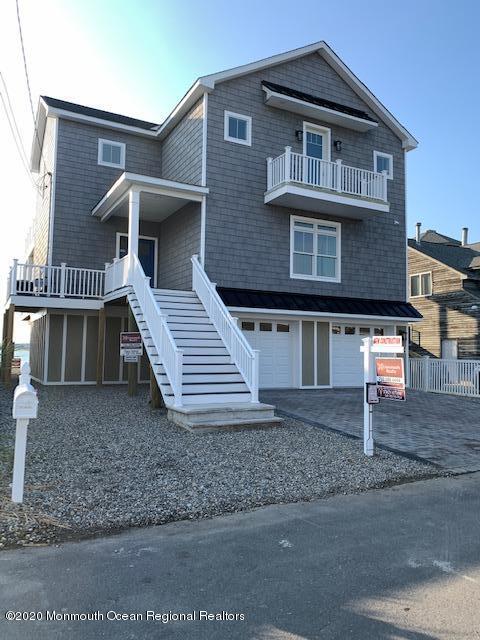 125 Shore Drive Brick, NJ 08723 - Photo 18 of 83 a front view of a house with a yard