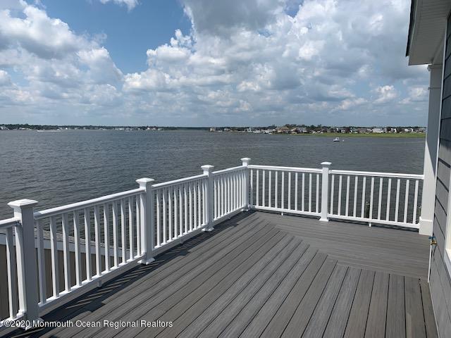 125 Shore Drive Brick, NJ 08723 - Photo 21 of 83 a view of a balcony with wooden floor and fence