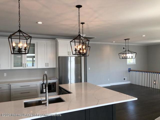 125 Shore Drive Brick, NJ 08723 - Photo 33 of 83 a view of a room with a chandelier wooden floor and windows