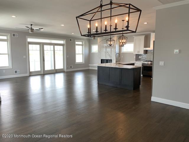 125 Shore Drive Brick, NJ 08723 - Photo 40 of 83 a view of a room with wooden floor and windows
