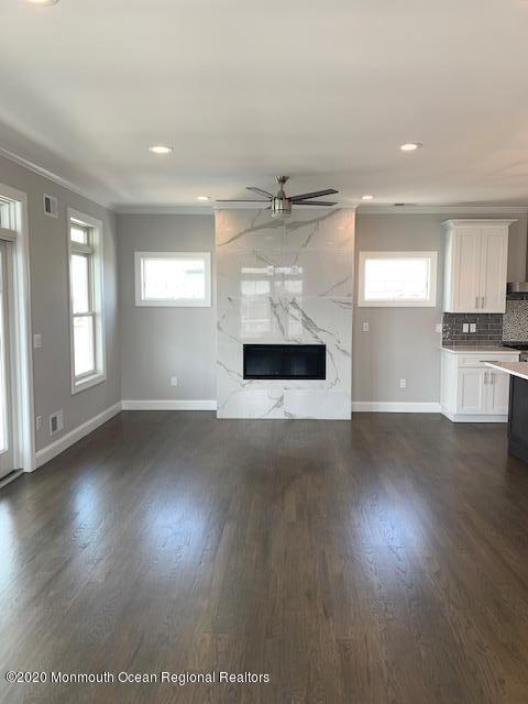 125 Shore Drive Brick, NJ 08723 - Photo 44 of 83 an empty room with wooden floor and windows