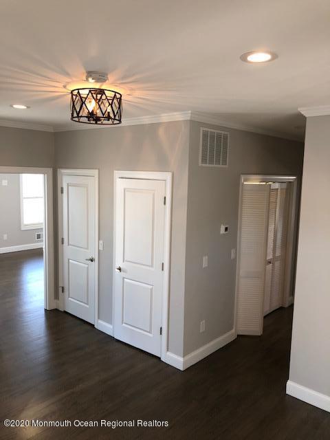 125 Shore Drive Brick, NJ 08723 - Photo 45 of 83 an empty room with wooden floor and windows
