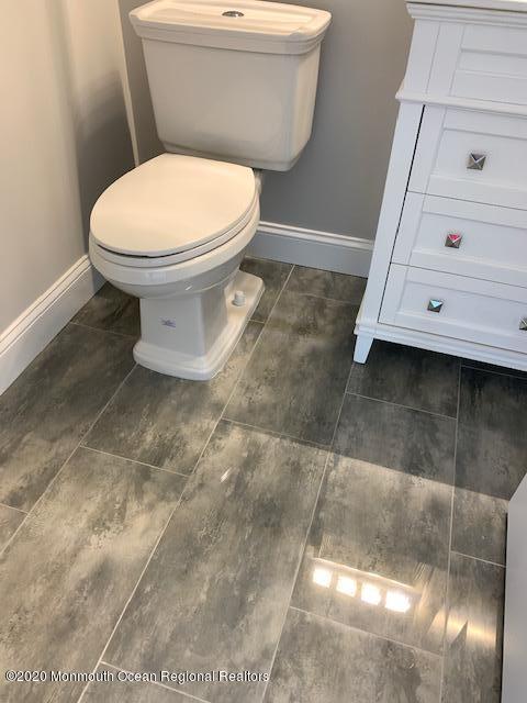 125 Shore Drive Brick, NJ 08723 - Photo 62 of 83 a bathroom with a toilet and a sink