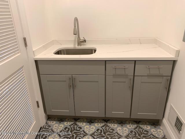 125 Shore Drive Brick, NJ 08723 - Photo 69 of 83 a bathroom with a sink and vanity