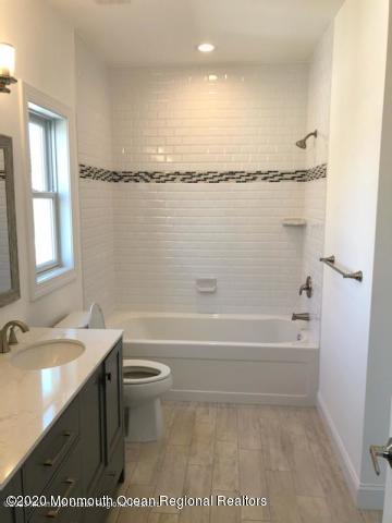 125 Shore Drive Brick, NJ 08723 - Photo 71 of 83 a bathroom with a sink a toilet and shower