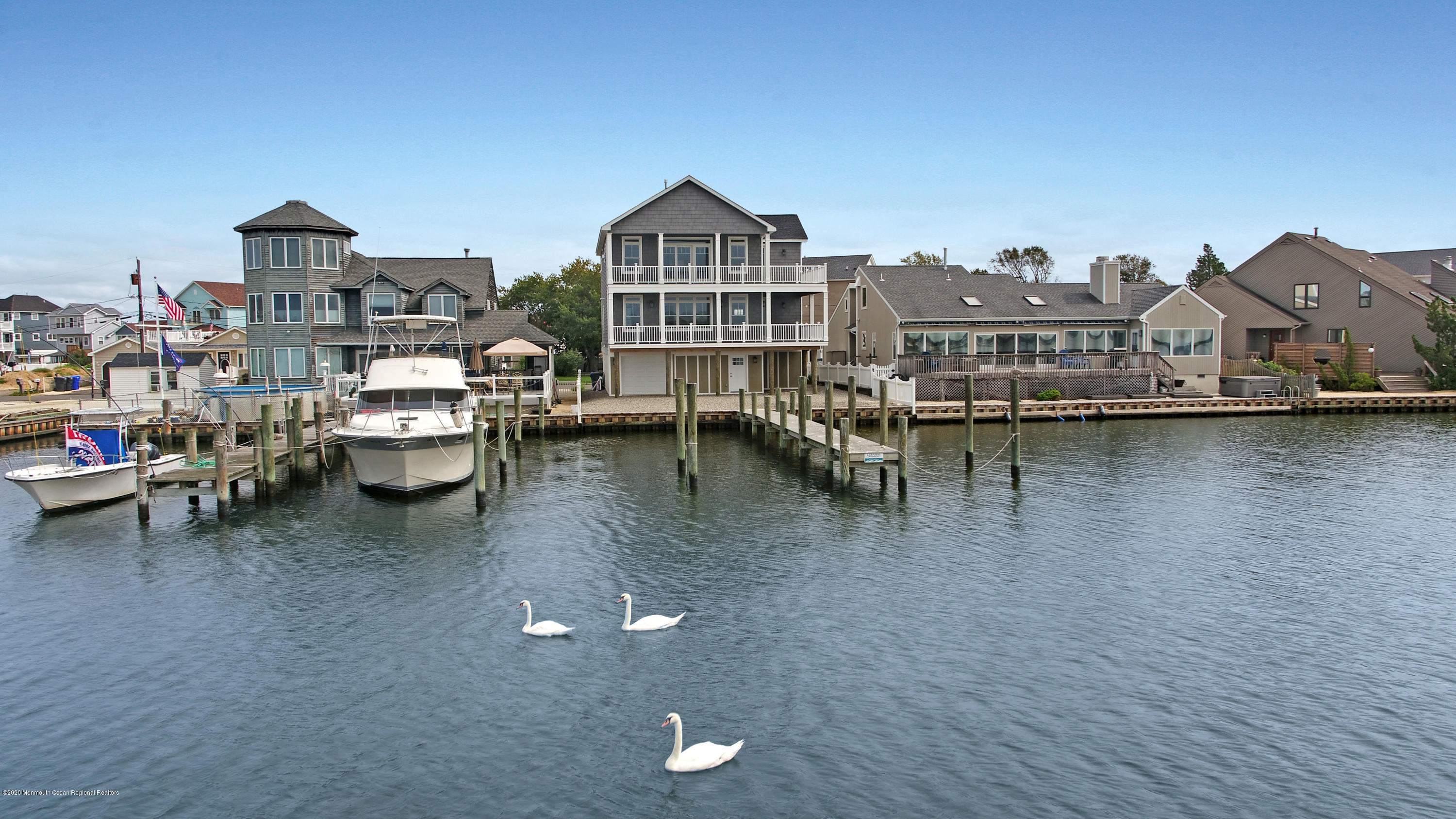 125 Shore Drive Brick, NJ 08723 - Photo 10 of 83 a view of a lake with a city from a terrace
