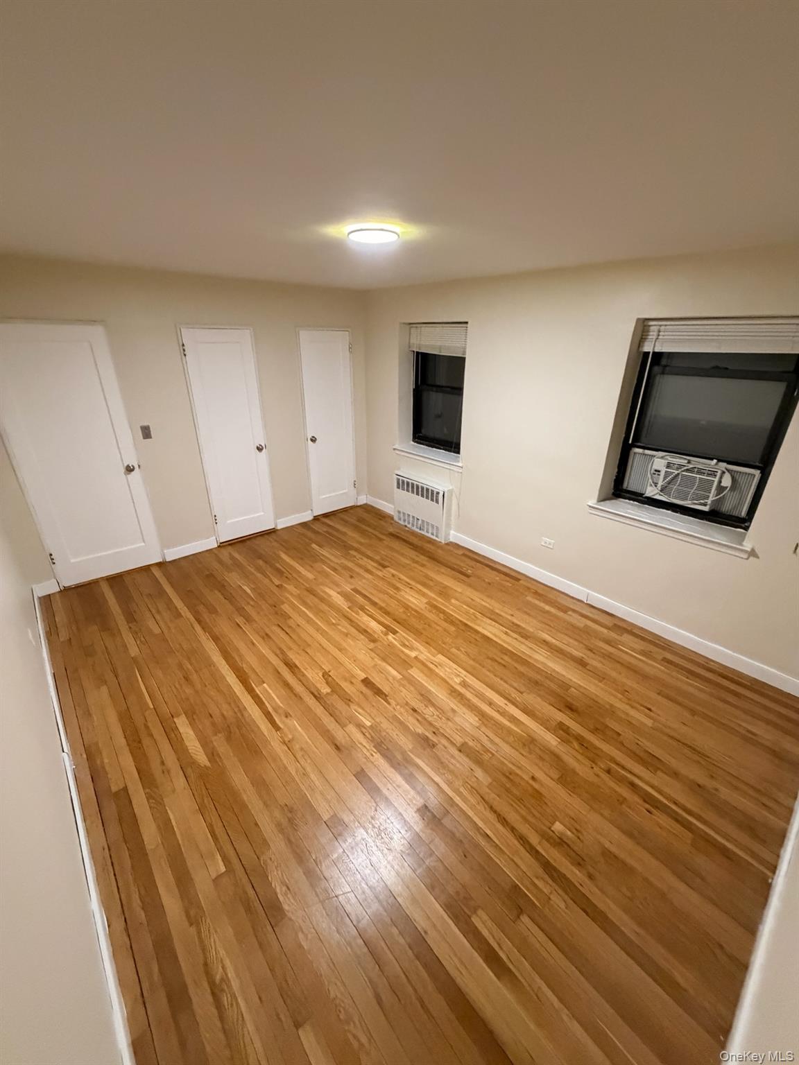 67-th Rd 10245th Queens, NY 11375 - Photo 5 of 6 a bedroom with a bed and a view of bathroom