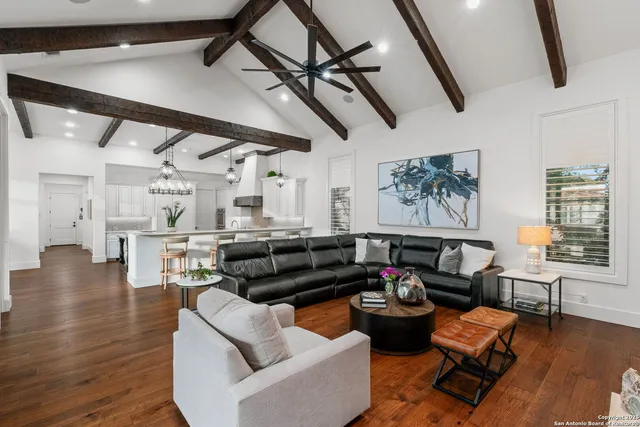 a view of a house with swimming pool and sitting area