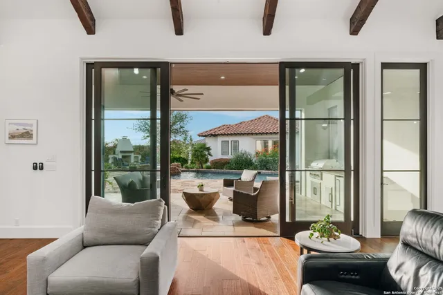 a building outdoor space with patio furniture and potted plants