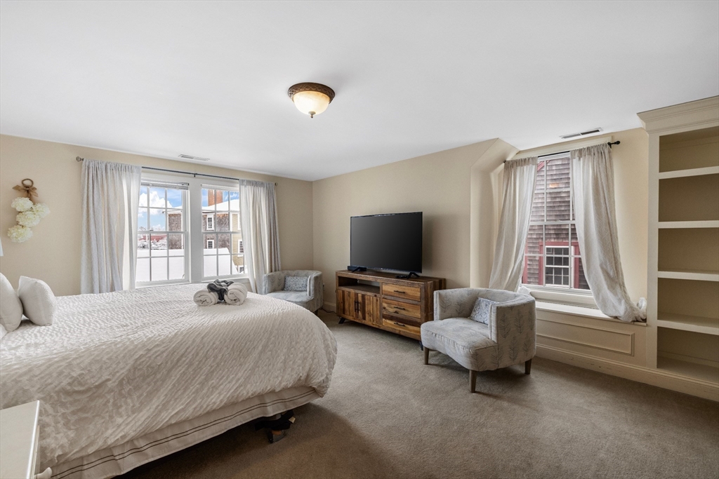 26 Central Street Manchester, MA 01944 - Photo 11 of 15 a bedroom with bed and large window