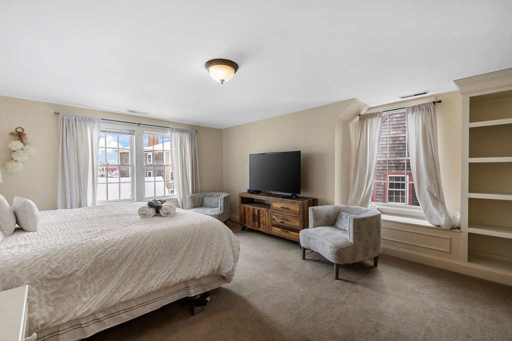 26 Central Street Manchester, MA 01944 - Photo 15 of 15 a bedroom with bed and large window