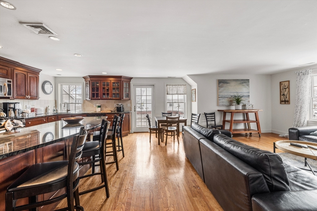 26 Central Street Manchester, MA 01944 - Photo 6 of 15 a living room with furniture and a wooden floor
