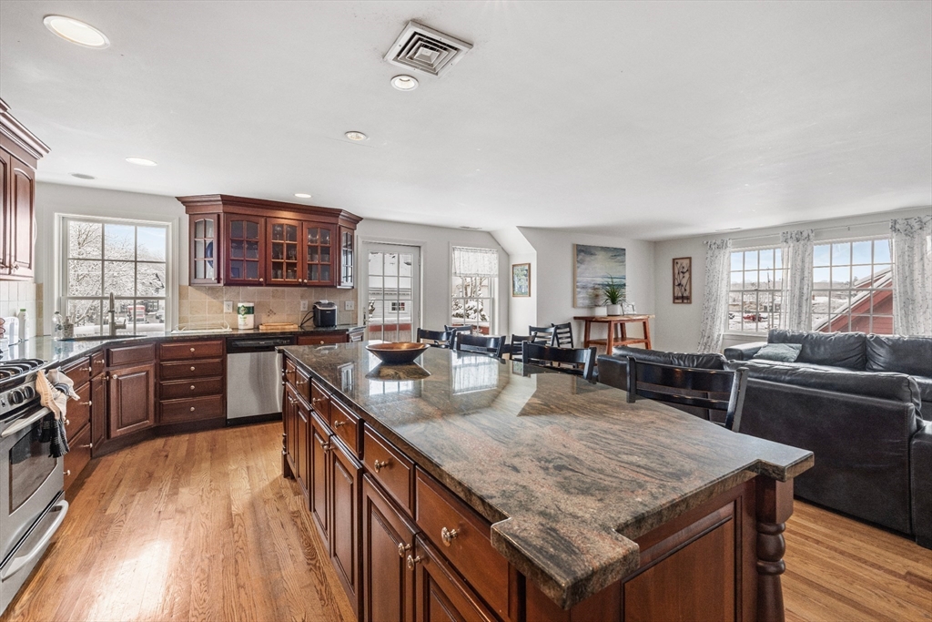 26 Central Street Manchester, MA 01944 - Photo 7 of 15 a kitchen with granite countertop lots of counter top space and stainless steel appliances