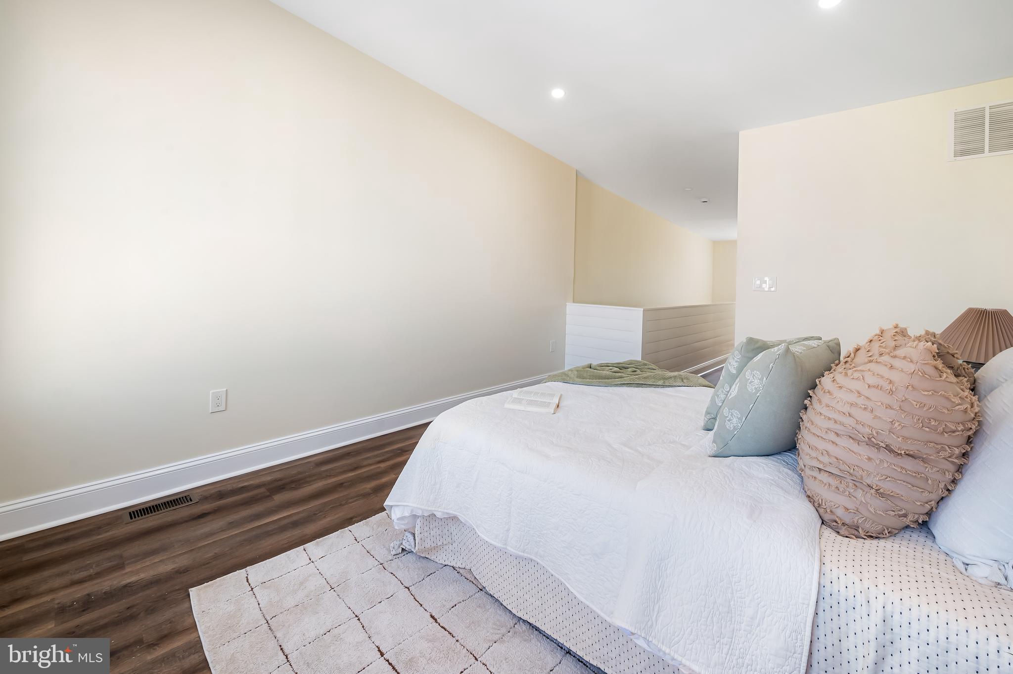 1722 McCulloh Street Baltimore, MD 21217 - Photo 24 of 36 a bedroom with a bed and a night stand