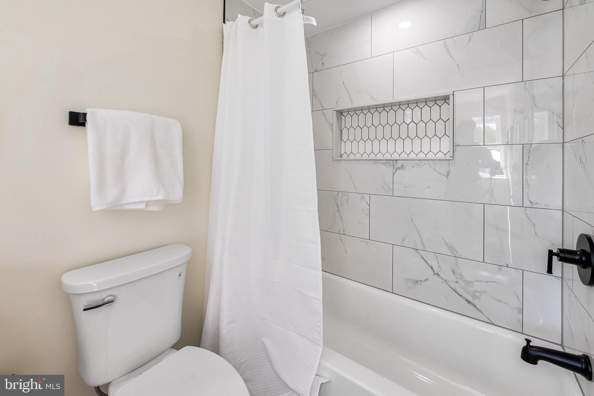 1722 McCulloh Street Baltimore, MD 21217 - Photo 26 of 36 a bathroom with a toilet and a shower