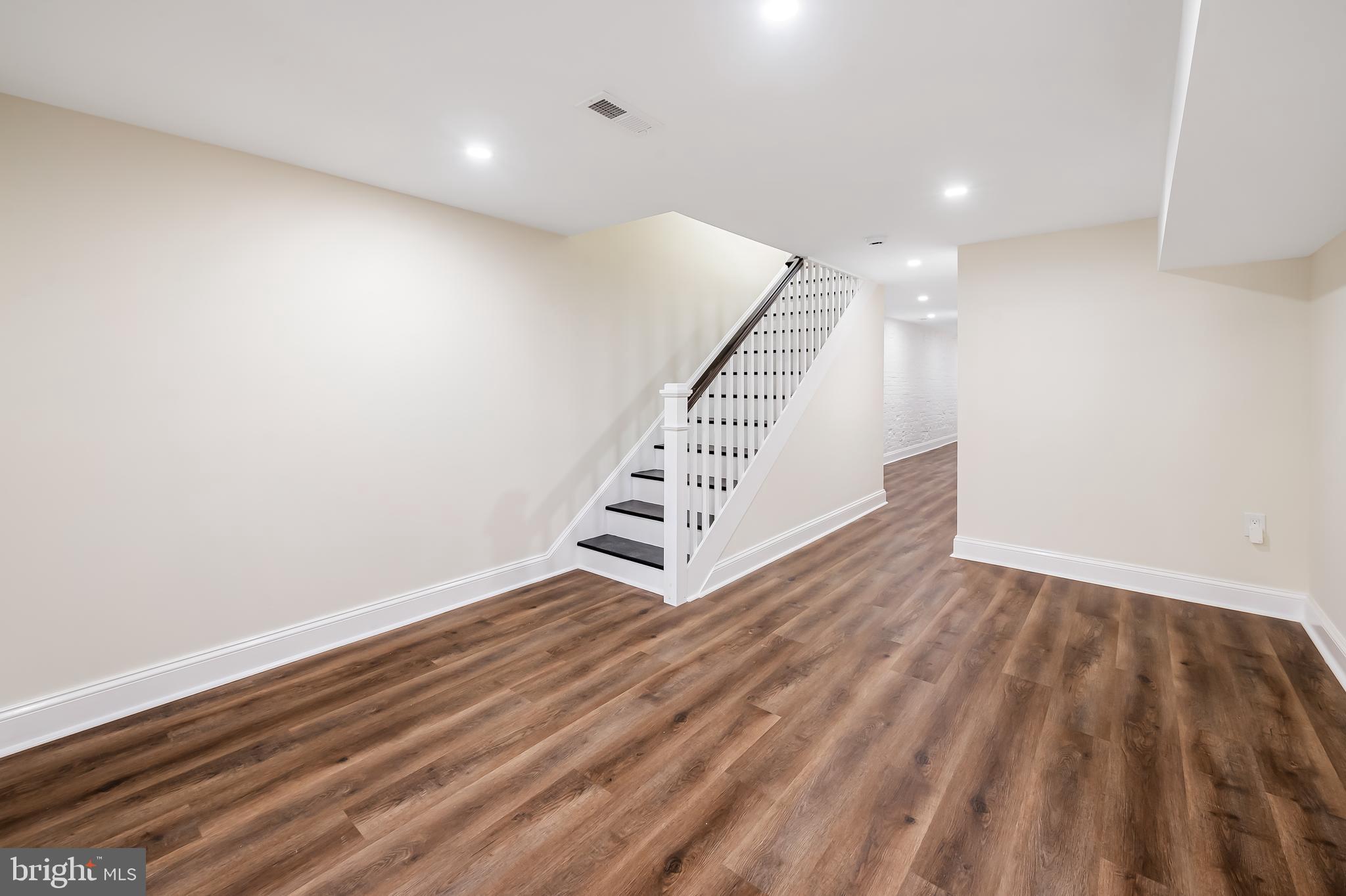 1722 McCulloh Street Baltimore, MD 21217 - Photo 29 of 36 a view of an empty room with stairs and ventilation