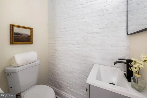a bathroom with a toilet and a sink