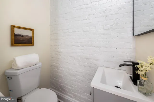 a bathroom with a toilet and a sink