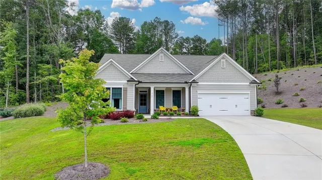 a front view of a house with garden