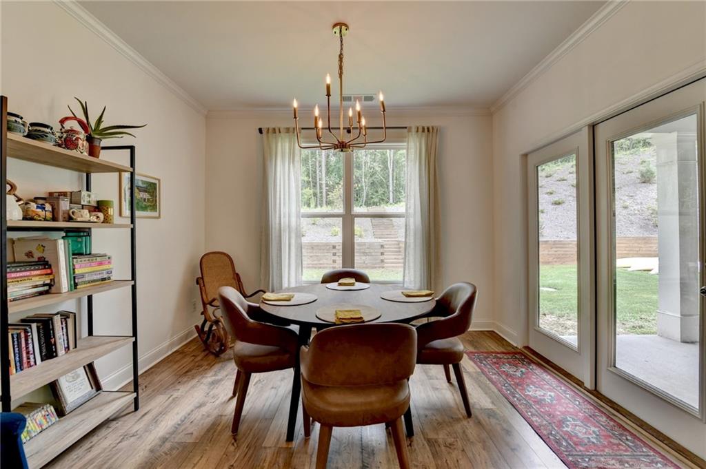 2129 Charmond Drive Monroe, GA 30656 - Photo 12 of 37 a view of a dining room with furniture window and wooden floor