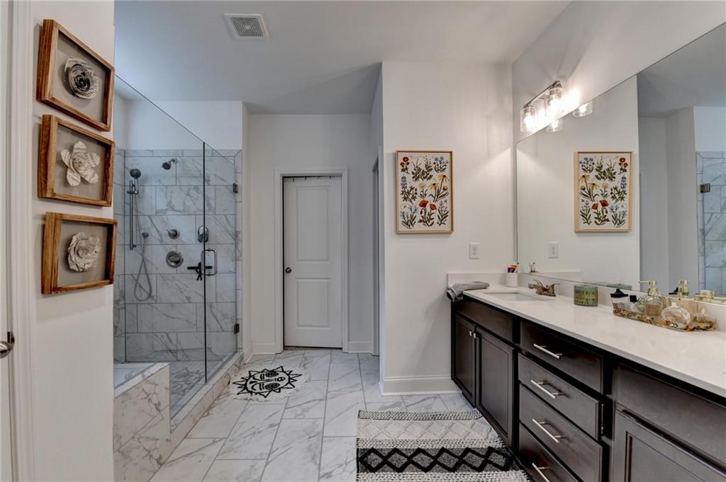2129 Charmond Drive Monroe, GA 30656 - Photo 18 of 37 a bathroom with a sink and a mirror