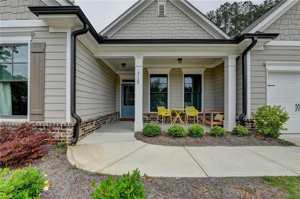 2129 Charmond Drive Monroe, GA 30656 - Photo 2 of 37 a front view of a house with garden