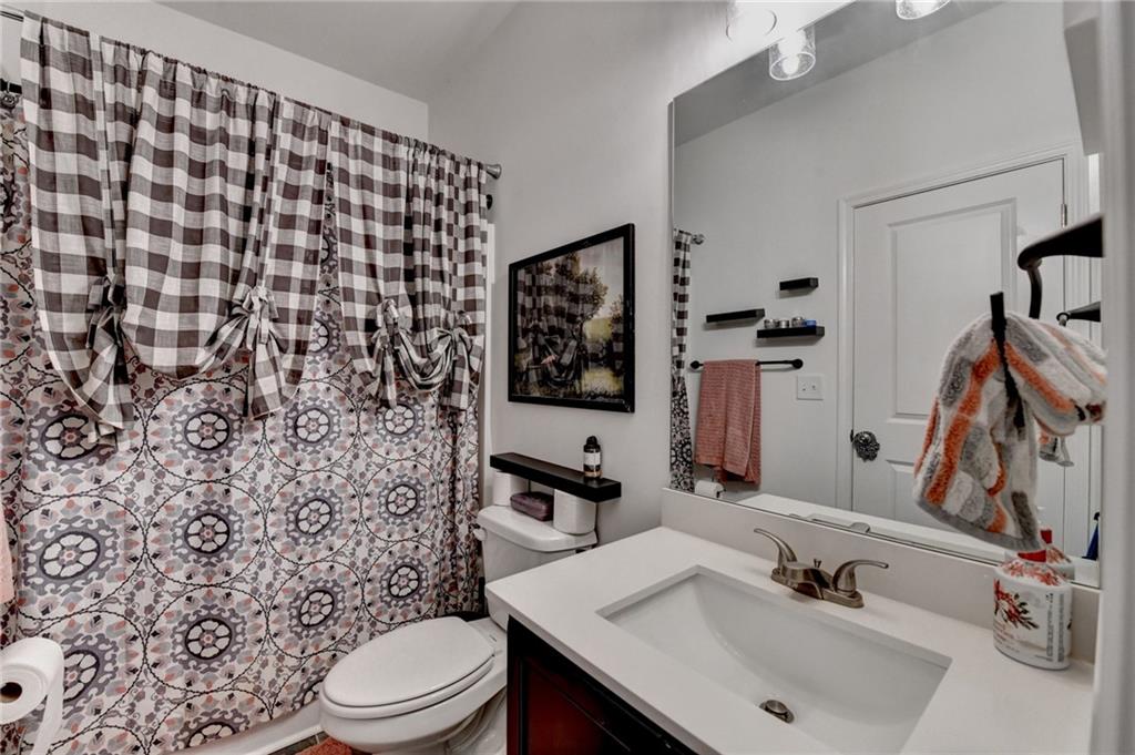 2129 Charmond Drive Monroe, GA 30656 - Photo 23 of 37 a bathroom with a sink toilet and shower