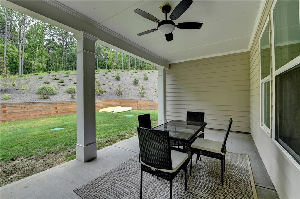 2129 Charmond Drive Monroe, GA 30656 - Photo 27 of 37 a view of a porch with furniture and a yard