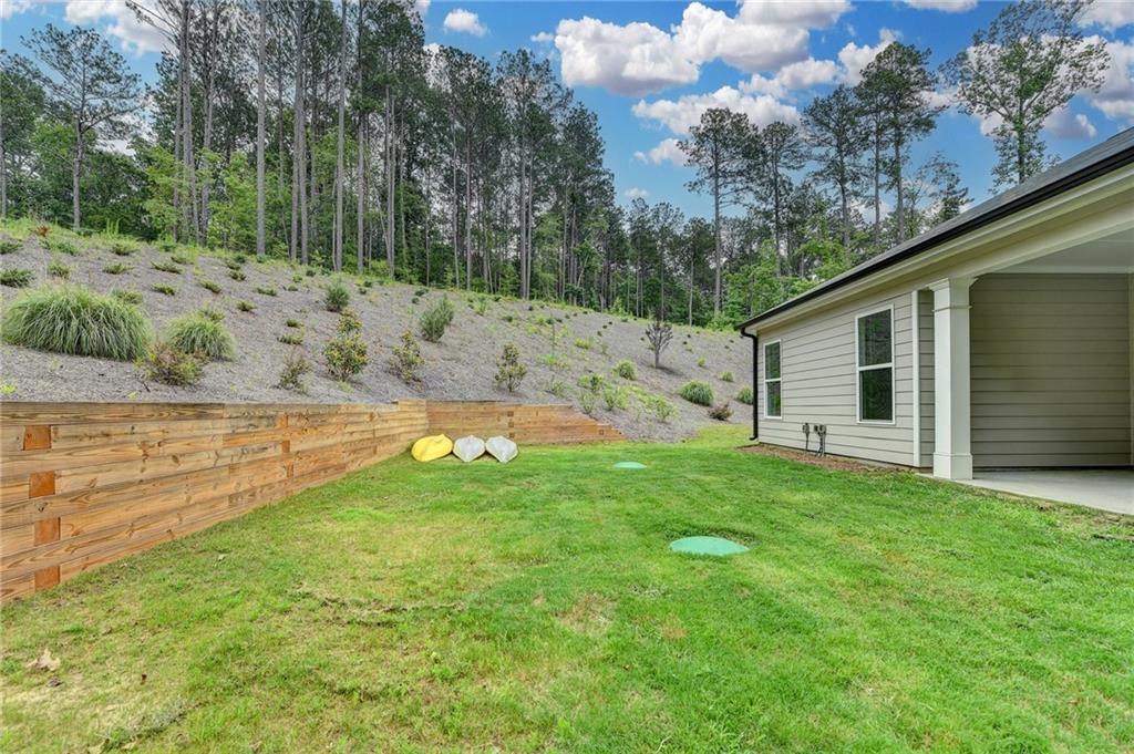 2129 Charmond Drive Monroe, GA 30656 - Photo 30 of 37 a view of a backyard with large trees