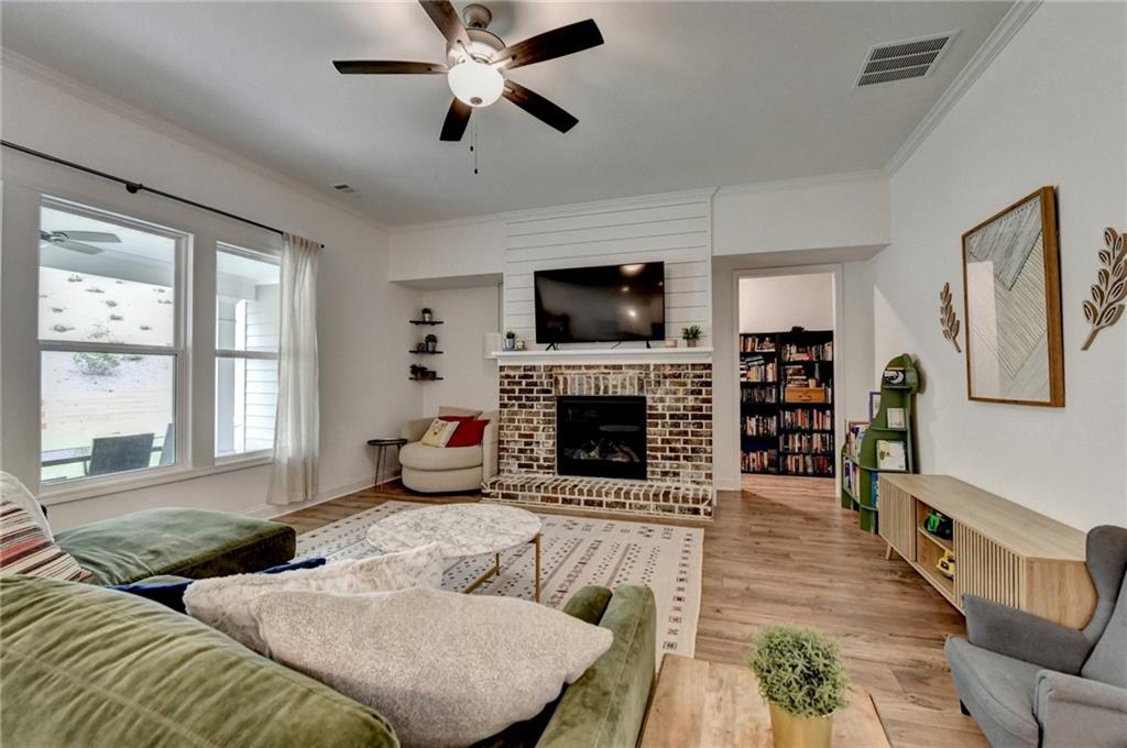 2129 Charmond Drive Monroe, GA 30656 - Photo 3 of 37 a living room with furniture flat screen tv and a fireplace