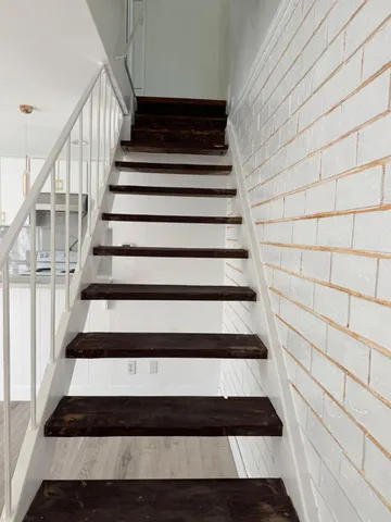 a bathroom with a sink a toilet a vanity and a mirror