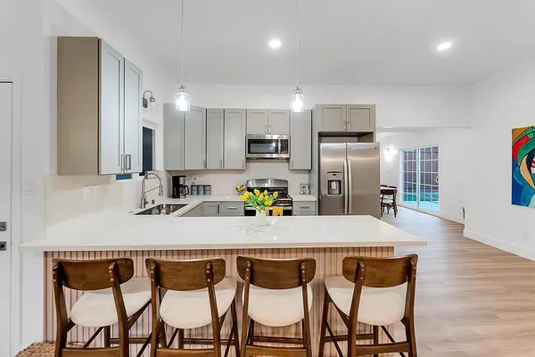 a backyard of a house with outdoor seating