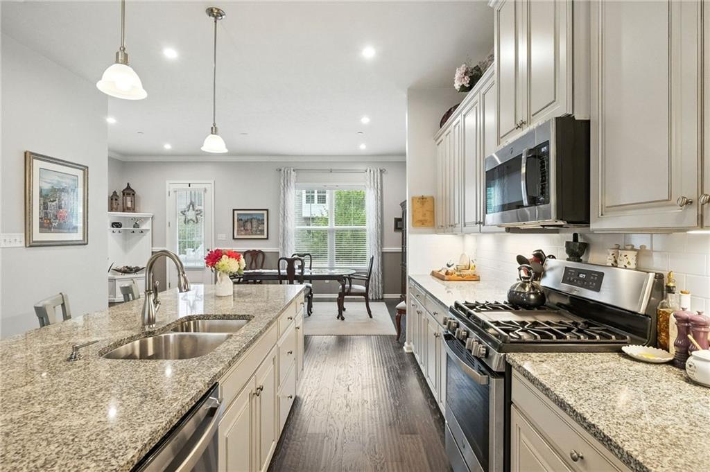 1006 Mohawk Lane Mars, PA 16046 - Photo 18 of 50 a kitchen with stainless steel appliances granite countertop a sink stove and refrigerator
