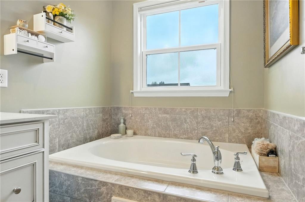 1006 Mohawk Lane Mars, PA 16046 - Photo 28 of 50 a white bath tub sitting next to a window