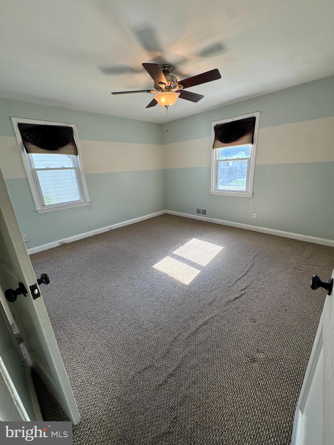 7408 Room Digby Road, Unit 1 Gwynn Oak, MD 21207 - Photo 3 of 9 a view of an empty room with a window