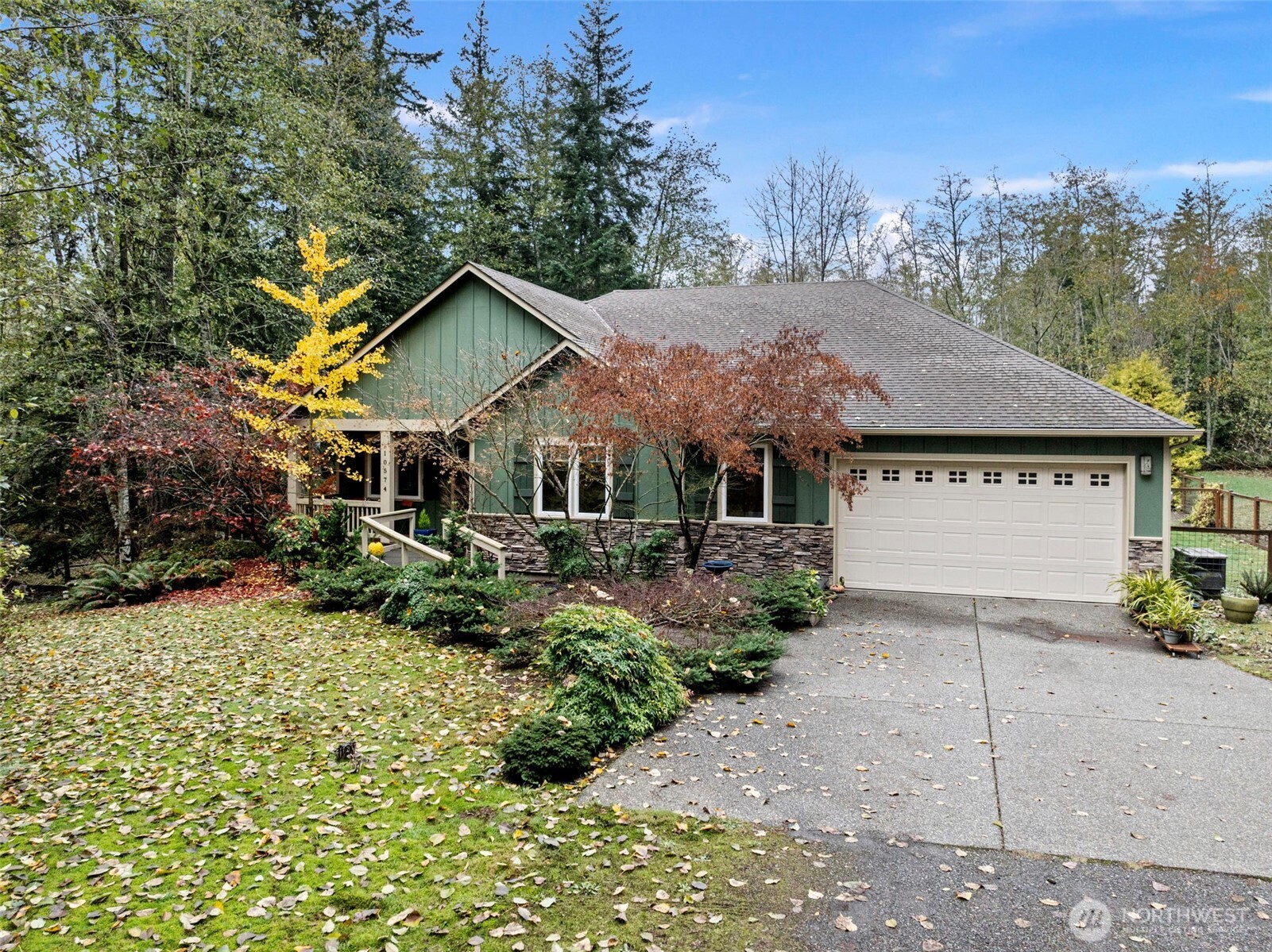 a view of house with yard and outdoor seating