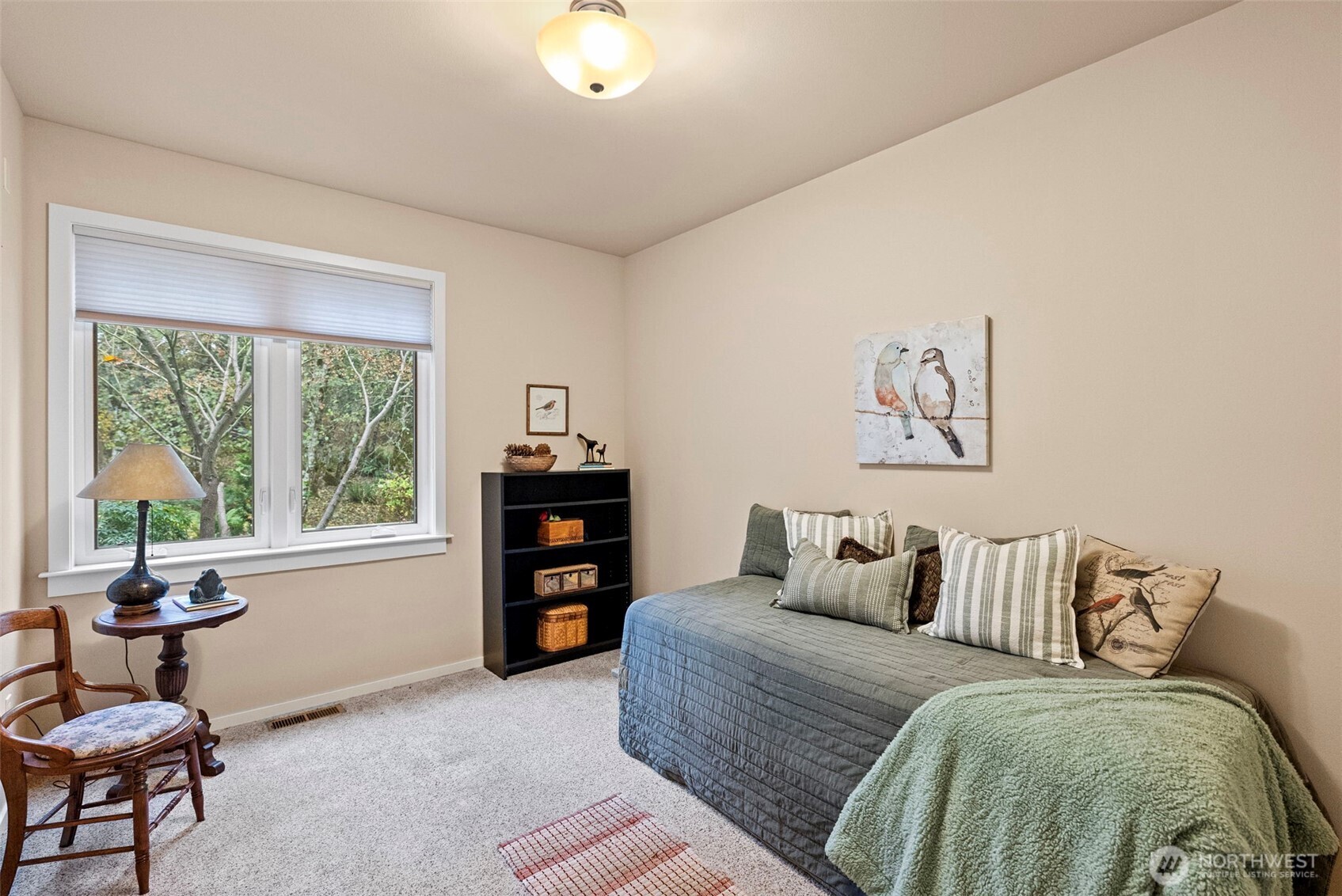 10574 Sidney Road Southwest Port Orchard, WA 98367 - Photo 19 of 37 a bedroom with a bed and a window