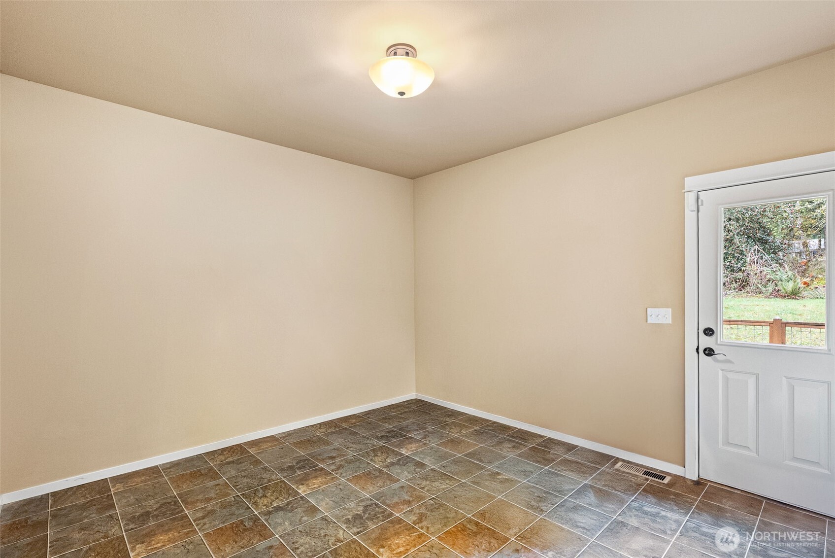 10574 Sidney Road Southwest Port Orchard, WA 98367 - Photo 21 of 37 an empty room with a empty space and a window