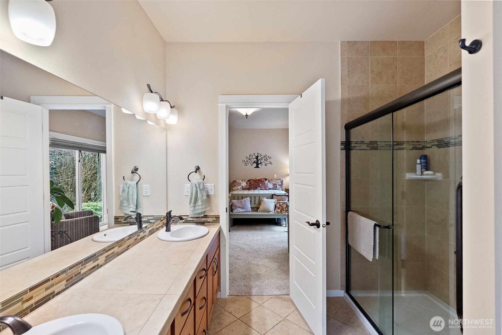 10574 Sidney Road Southwest Port Orchard, WA 98367 - Photo 25 of 37 a en suite bathroom with a double vanity sink and large mirror